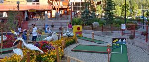 Kids playing minature golf in the Heavenly Village
